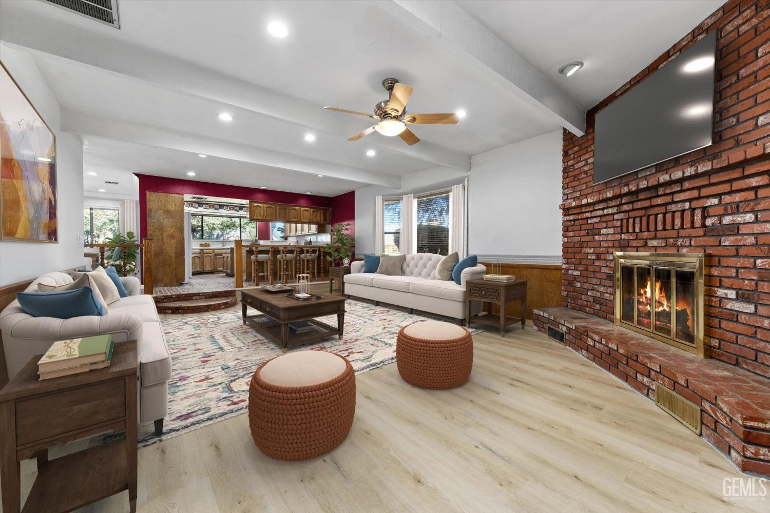 Undisclosed Address Bakersfield, CA 93312 - Photo 8 of 49 a living room with furniture a fireplace and a flat screen tv