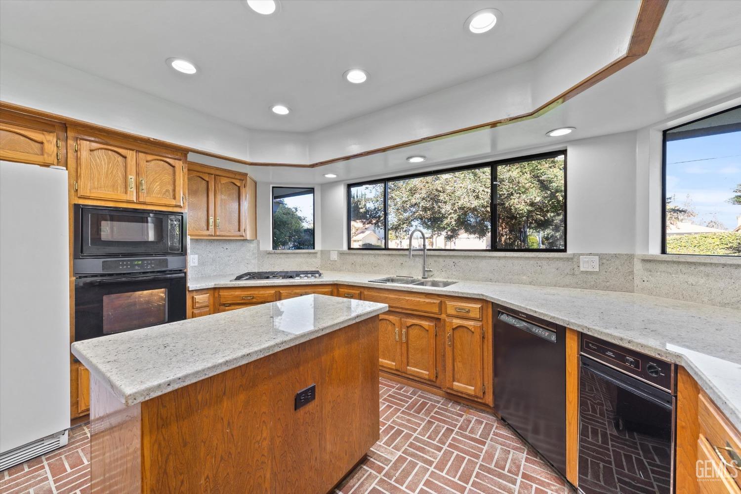 Undisclosed Address Bakersfield, CA 93312 - Photo 10 of 49 a kitchen with stainless steel appliances granite countertop sink stove and refrigerator