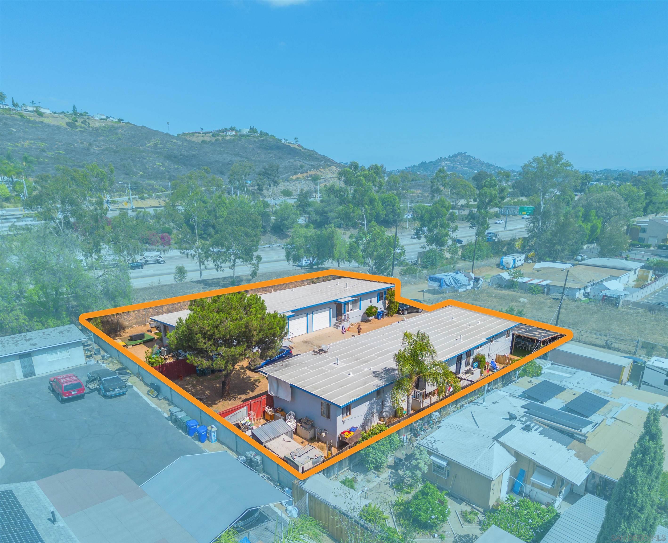 8050 Lemon Grove Way Lemon Grove, CA 91945 - Photo 3 of 19 a view of a pool with a back yard