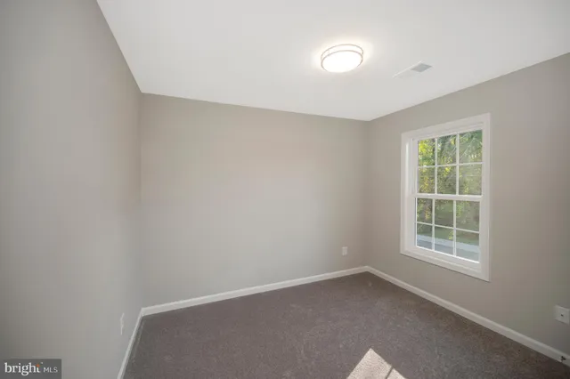 a front view of a building with garden