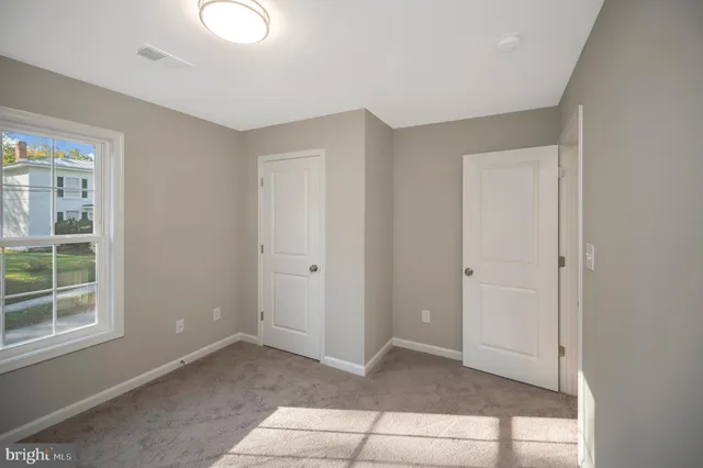 a front view of a building with large windows