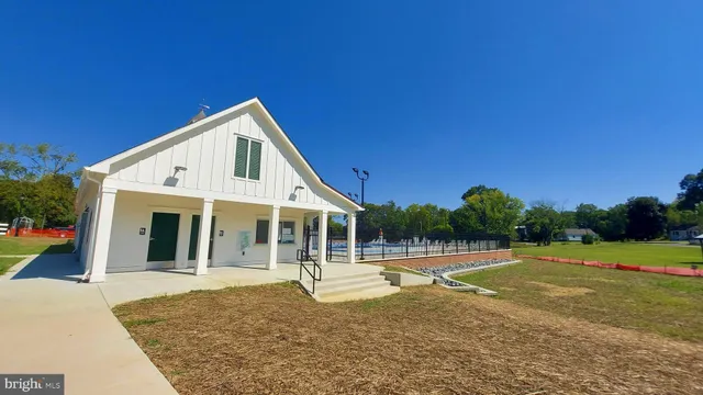 a city street lined with buildings and trees