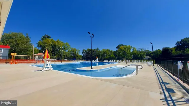 a view of backyard of house with green space