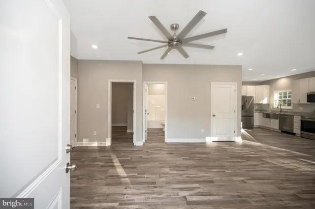 a view of a livingroom with furniture and wooden floor
