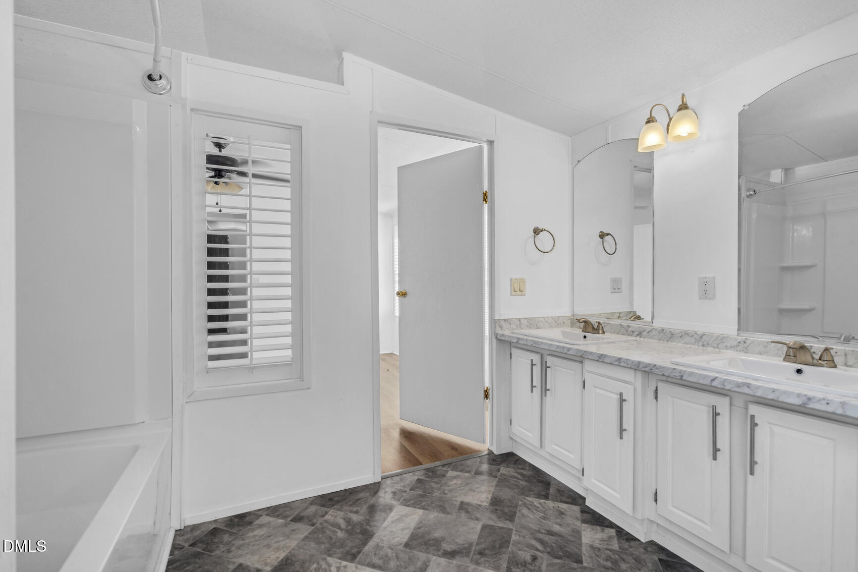 6515 Tonya Road Elm City, NC 27822 - Photo 39 of 52 a bathroom with a double vanity sink and a mirror