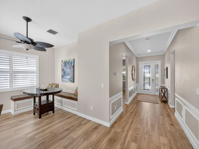 a view of a room with lots of wooden furniture