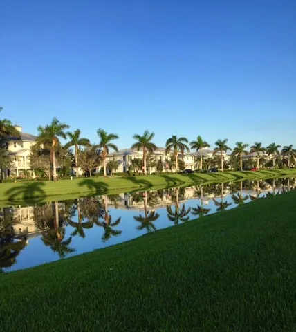 a view of a golf course with a lake