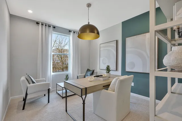 a dining room with furniture and window