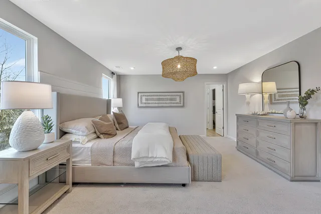 a bedroom with bed and window