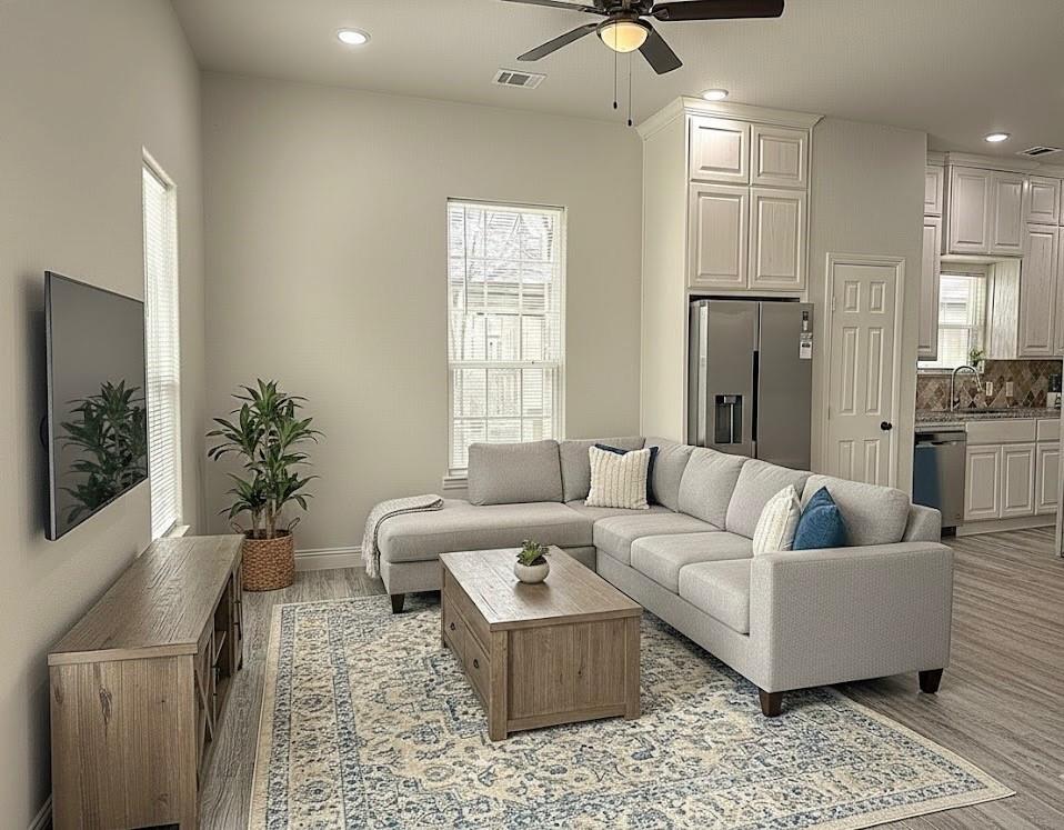 605 Olive Street Cleburne, TX 76031 - Photo 1 of 40 a living room with furniture and a large window