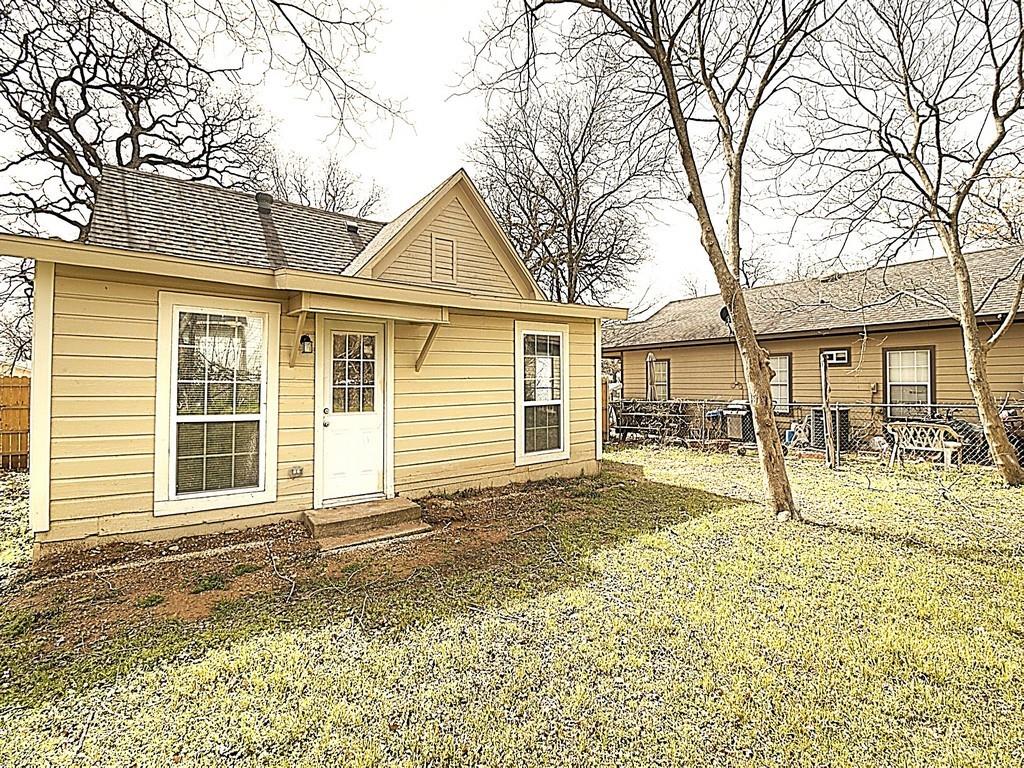 605 Olive Street Cleburne, TX 76031 - Photo 20 of 40 Back of house featuring fence
