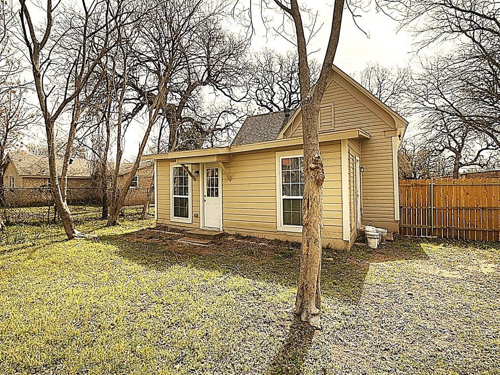 605 Olive Street Cleburne, TX 76031 - Photo 33 of 40 View of outbuilding with a fenced backyard