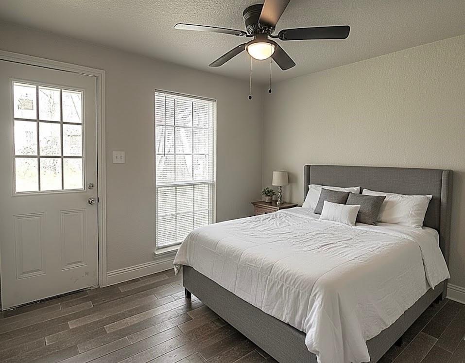 605 Olive Street Cleburne, TX 76031 - Photo 39 of 40 a bedroom with a large bed and a window