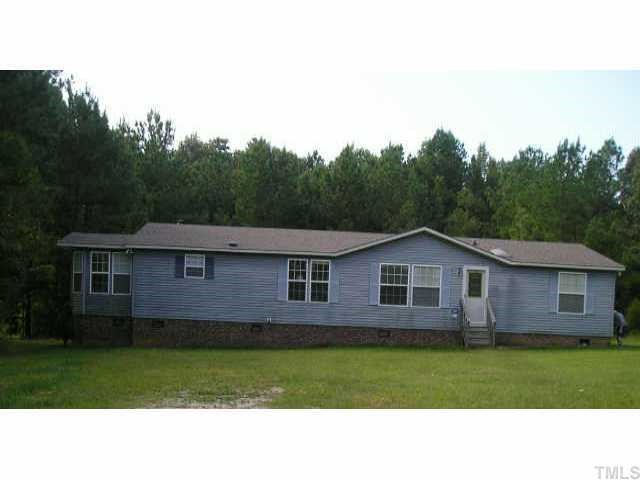 12645 Eagle Ridge Drive Zebulon, NC 27597 - Photo 1 of 1 a black and white photo of a house