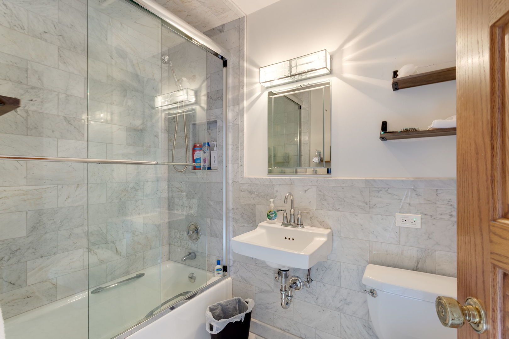 1490 Lake Road Lake Forest, IL 60045 - Photo 26 of 44 a bathroom with a sink toilet and shower
