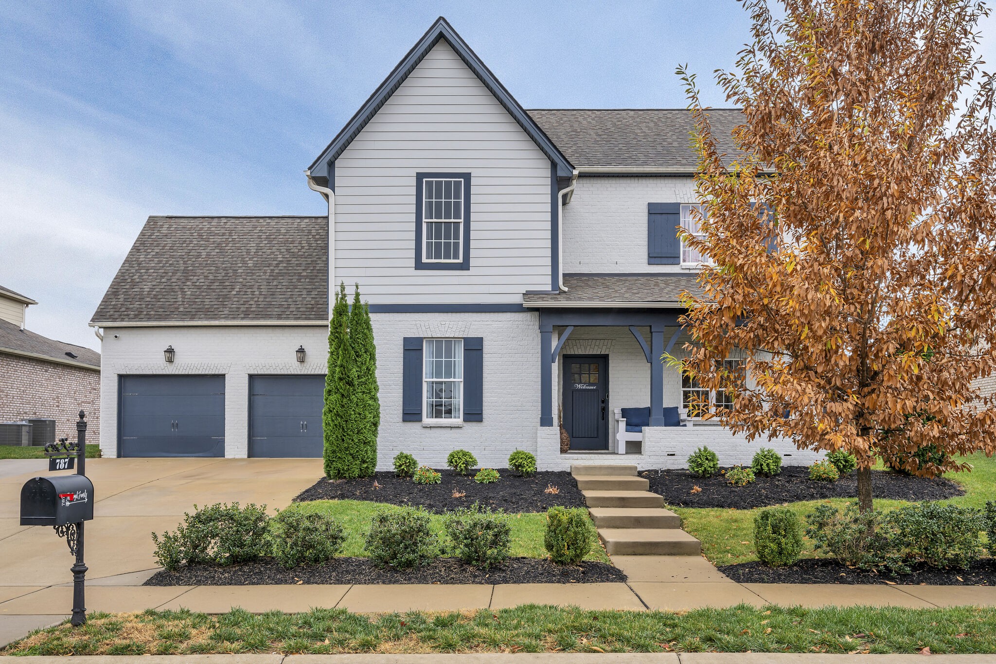 787 Plowson Road Mount Juliet, TN 37122 - Photo 1 of 30 a front view of a house with a yard and potted plants