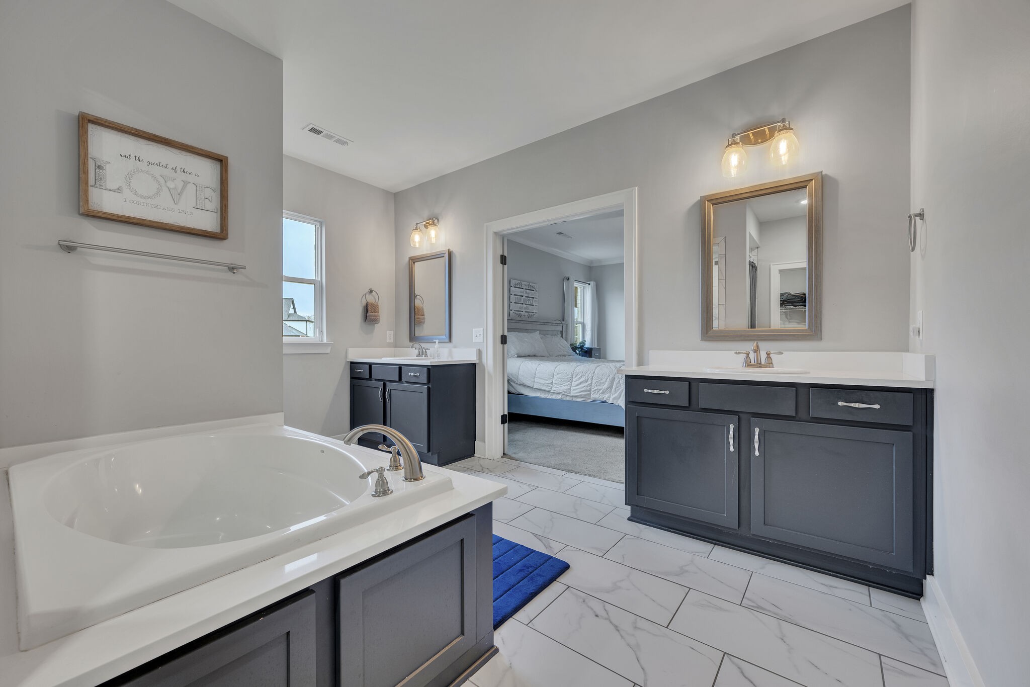 787 Plowson Road Mount Juliet, TN 37122 - Photo 12 of 30 a bathroom with a tub sink and mirror