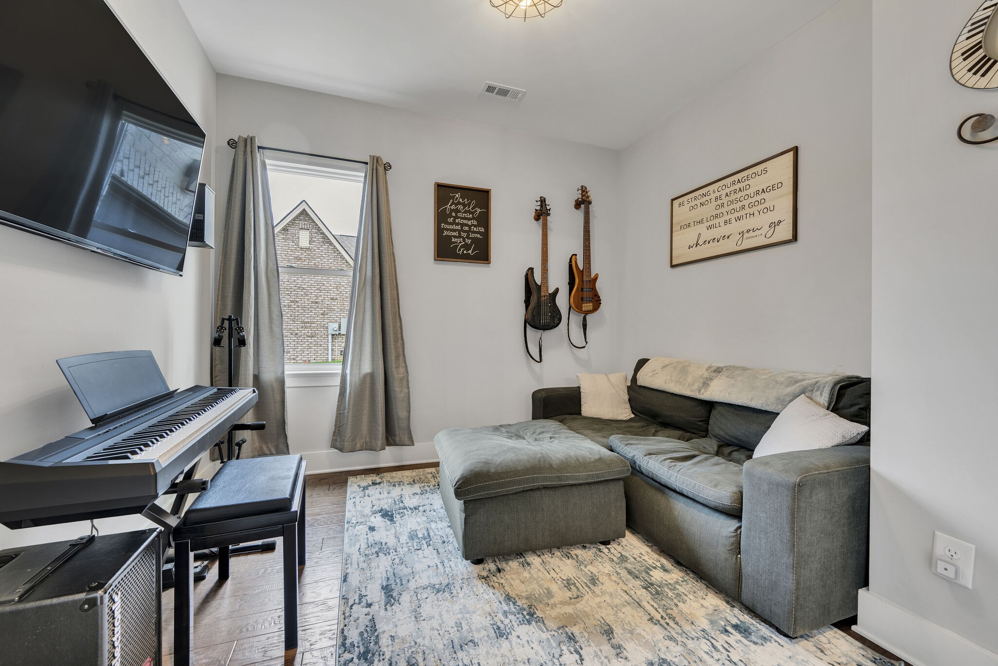 787 Plowson Road Mount Juliet, TN 37122 - Photo 16 of 30 a living room with furniture and a flat screen tv