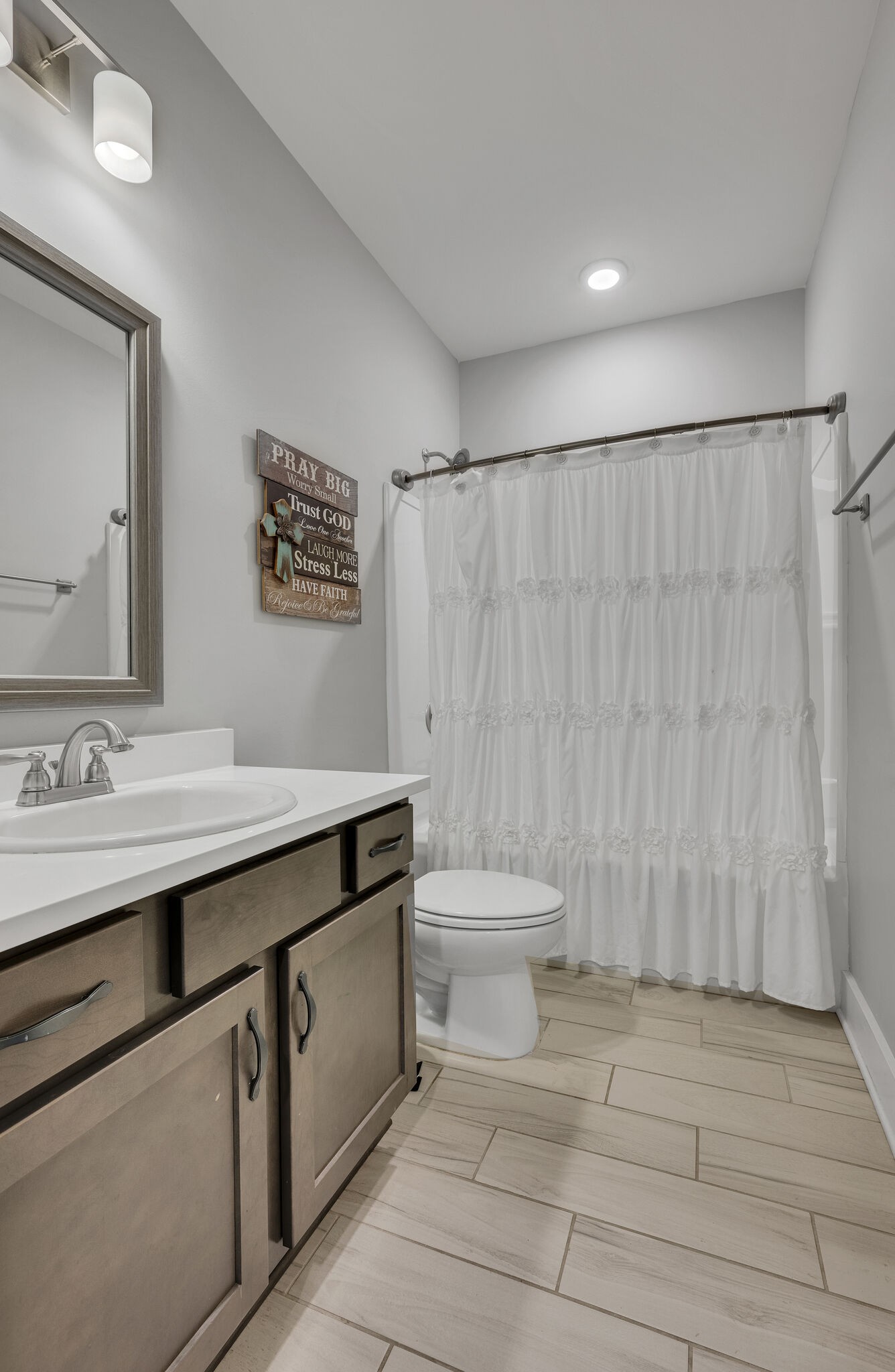 787 Plowson Road Mount Juliet, TN 37122 - Photo 17 of 30 a bathroom with a sink a toilet and a mirror