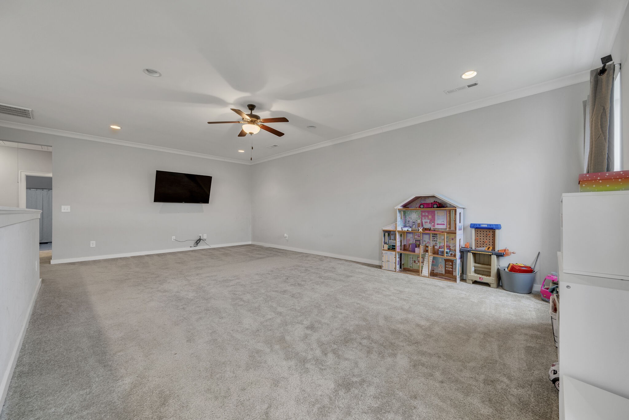 787 Plowson Road Mount Juliet, TN 37122 - Photo 19 of 30 a view of a livingroom with a furniture and a ceiling fan