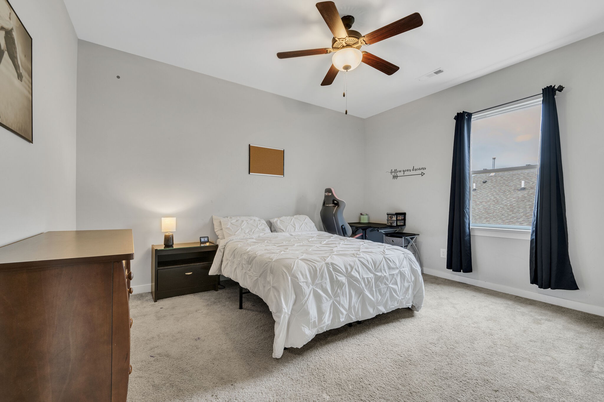 787 Plowson Road Mount Juliet, TN 37122 - Photo 23 of 30 a bedroom with a bed and a chandelier