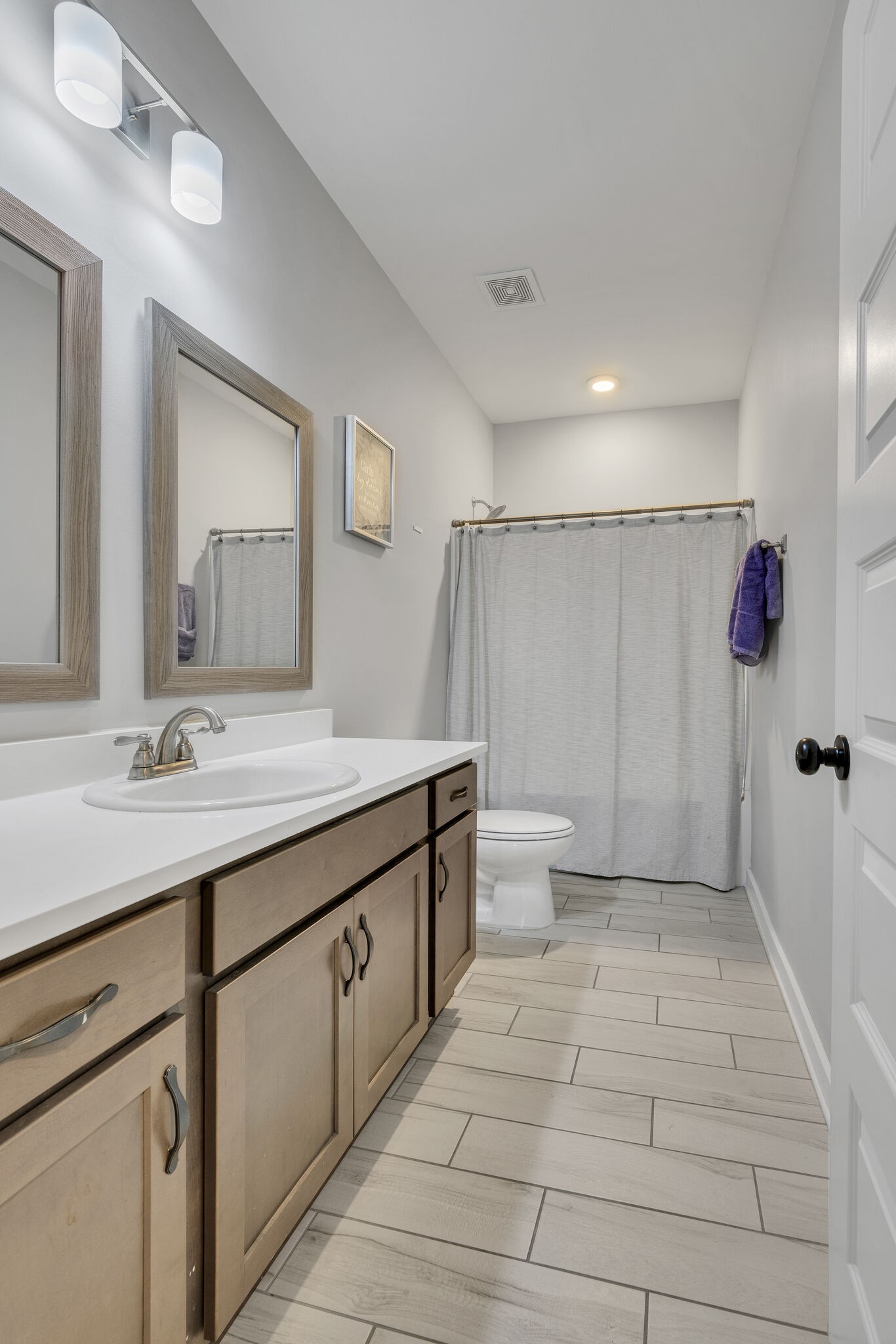 787 Plowson Road Mount Juliet, TN 37122 - Photo 24 of 30 a bathroom with a sink a toilet and shower