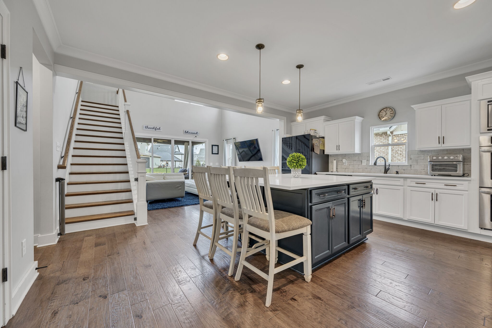 787 Plowson Road Mount Juliet, TN 37122 - Photo 4 of 30 a kitchen with a table chairs and a refrigerator