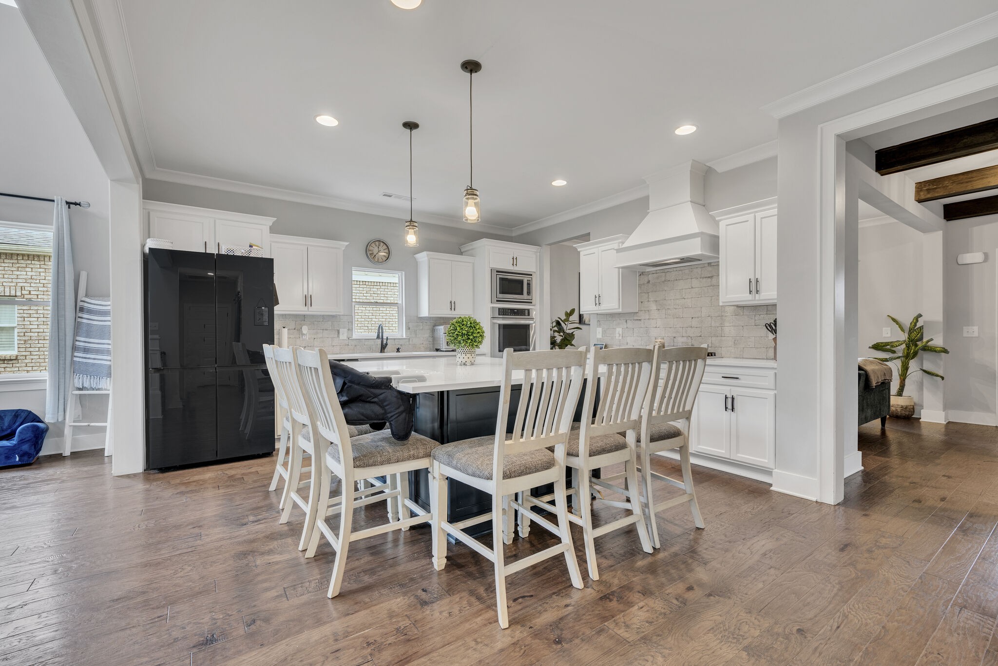 787 Plowson Road Mount Juliet, TN 37122 - Photo 5 of 30 a kitchen with stainless steel appliances kitchen island granite countertop a table chairs and a refrigerator