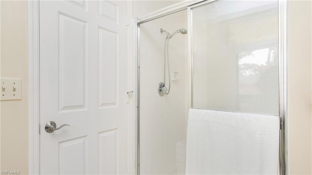 13015 Imperial Park Place, Unit 4R Naples, FL 34110 - Photo 15 of 31 Bathroom with walk in shower