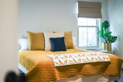a bathroom with double vanity windows and a sink
