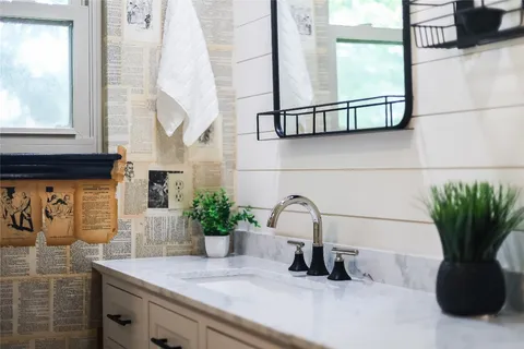 a bathroom with a sink and a mirror