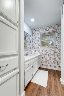 a view of a house with a yard and tree