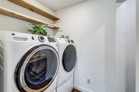 a view of a swimming pool with a yard and sitting area