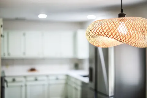 a kitchen with stainless steel appliances a refrigerator sink and cabinets