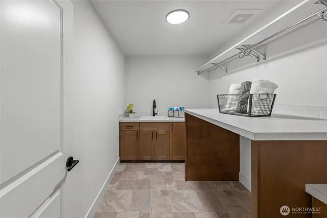 a utility room with cabinets