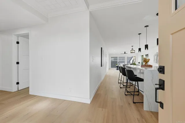 a view of kitchen and dining room with wooden floor