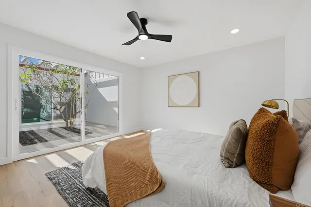 a bed room with a bed and a window