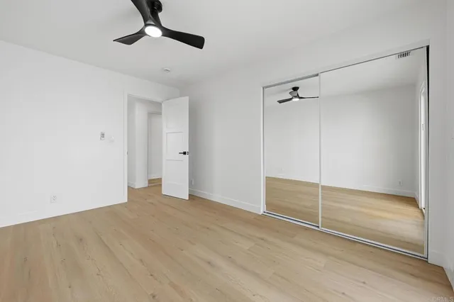 a view of an empty room with a glass door