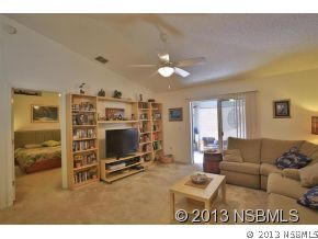 2032 Mango Tree Drive Edgewater, FL 32141 - Photo 11 of 24 a living room with furniture and a flat screen tv