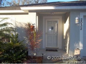 2032 Mango Tree Drive Edgewater, FL 32141 - Photo 20 of 24 a view of a wooden door