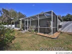 2032 Mango Tree Drive Edgewater, FL 32141 - Photo 24 of 24 a view of an house with backyard space and balcony