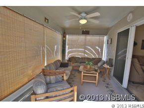 2032 Mango Tree Drive Edgewater, FL 32141 - Photo 3 of 24 a living room with furniture and a flat screen tv
