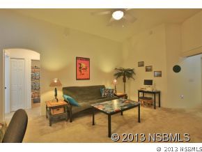 2032 Mango Tree Drive Edgewater, FL 32141 - Photo 5 of 24 a living room with a table and a potted plant