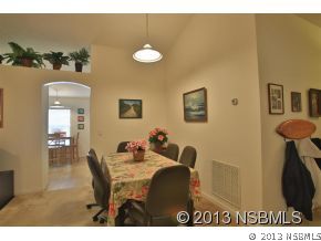 2032 Mango Tree Drive Edgewater, FL 32141 - Photo 7 of 24 a view of a dining room with furniture
