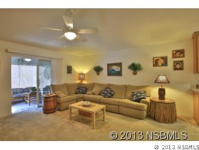 2032 Mango Tree Drive Edgewater, FL 32141 - Photo 10 of 24 a living room with furniture and a large window