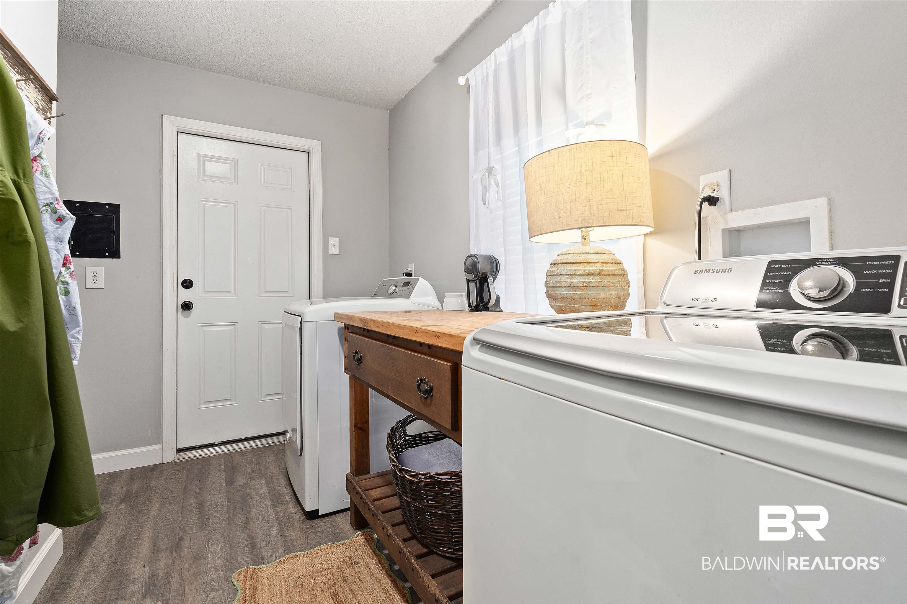 4682 Opal Drive Mobile, AL 36619 - Photo 22 of 27 Washroom featuring hardwood / wood-style floors and washing machine and clothes dryer