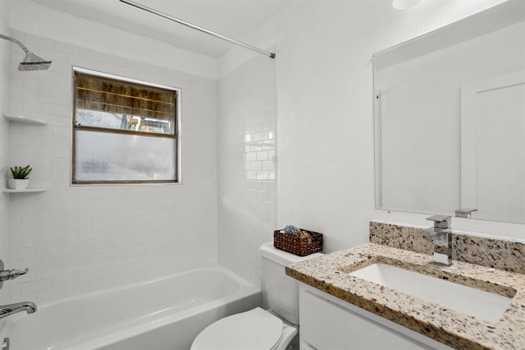 301 East 33rd Street, Unit 4 Austin, TX 78705 - Photo 8 of 10 Bathroom featuring shower / washtub combination and vanity