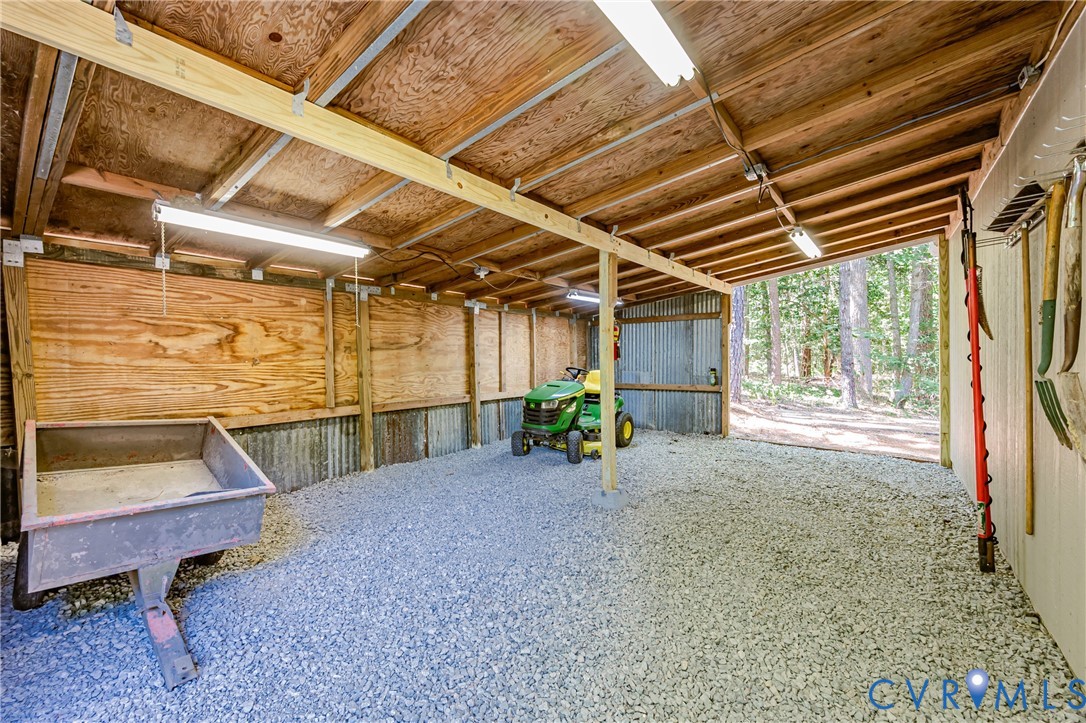 16110 Rowlett Road Chesterfield, VA 23838 - Photo 6 of 23 Lean-to storage on the back of the garage