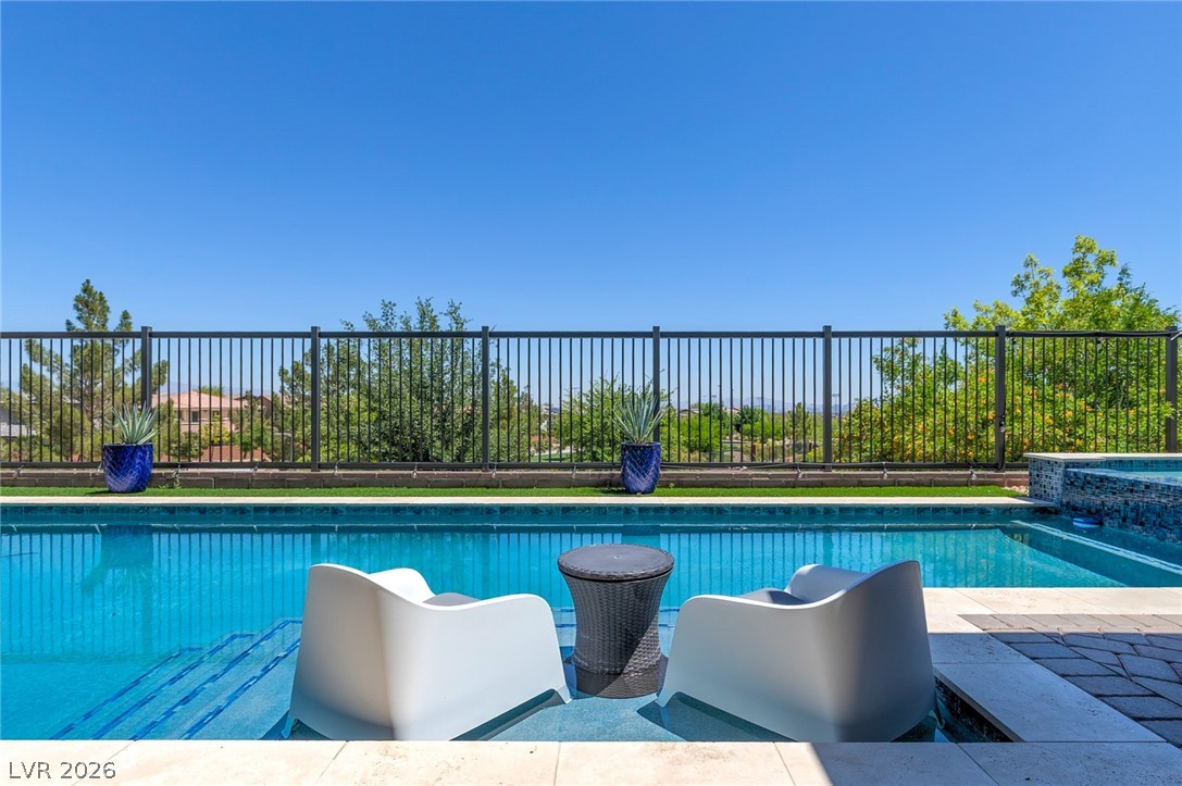 6014 Willow Ridge Court Las Vegas, NV 89135 - Photo 67 of 99 This tranquil outdoor oasis features a private pool, ideal for relaxation and entertaining.