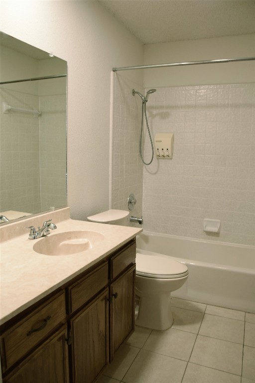 1911 Klattenhoff Drive Austin, TX 78728 - Photo 8 of 14 Bathroom with vanity, shower / tub combination, and light tile patterned floors